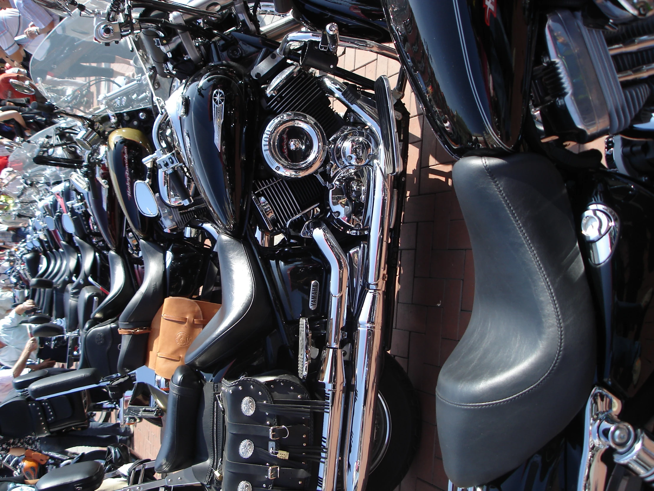 a display of many different motorcycles parked side by side