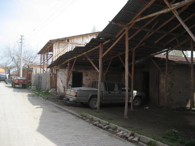 a pickup truck parked at a covered patio area