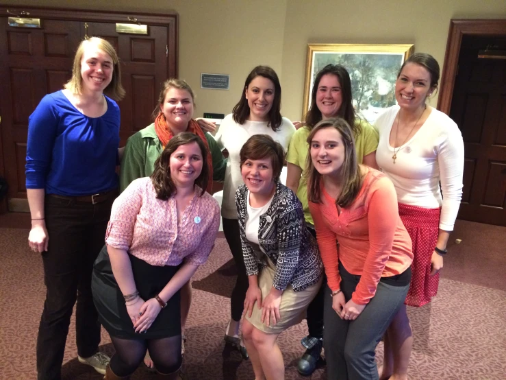 a group of women standing next to each other