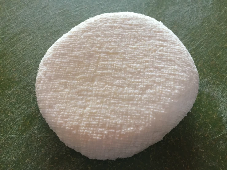 a round dish with white stuff on it