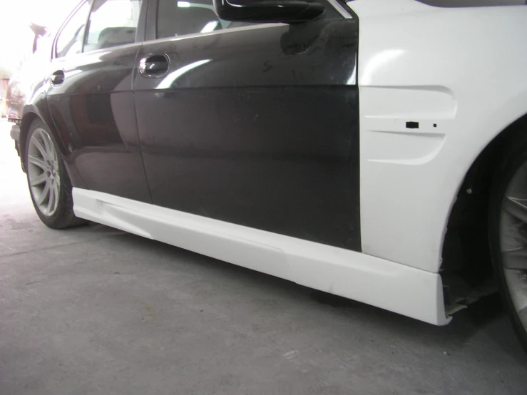 this is the side view of a car with black paint and white stripeing