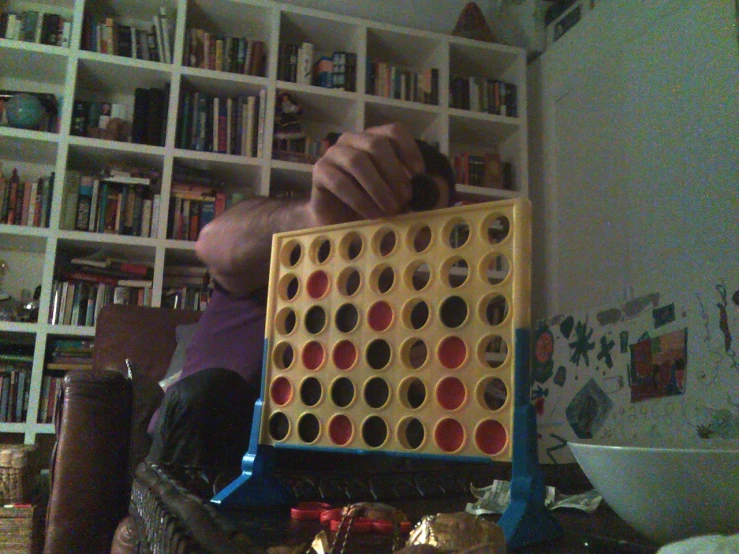 a guy playing with a giant 4x4 giant board