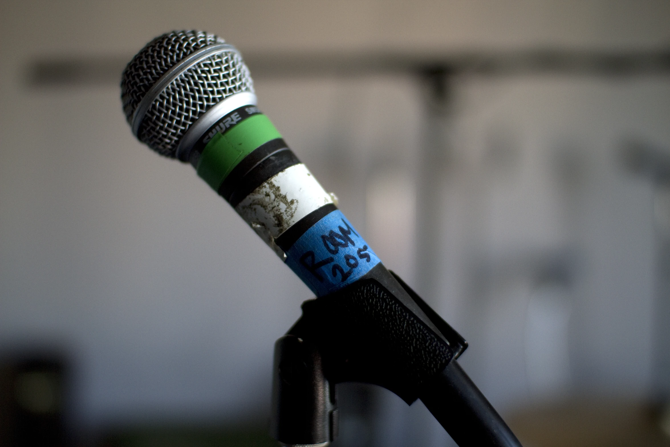 an old style microphone with the words new on it