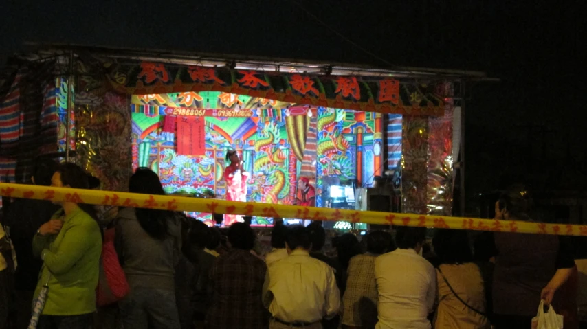 a stage with people standing in front of it
