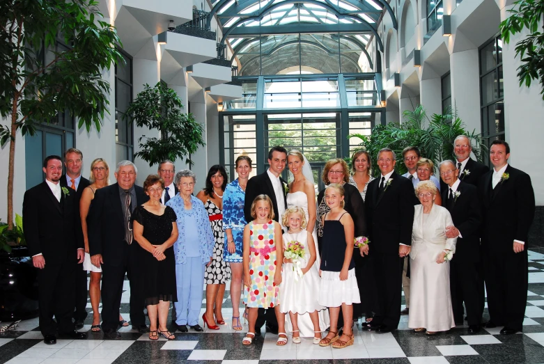 wedding party group posing in a formal hall