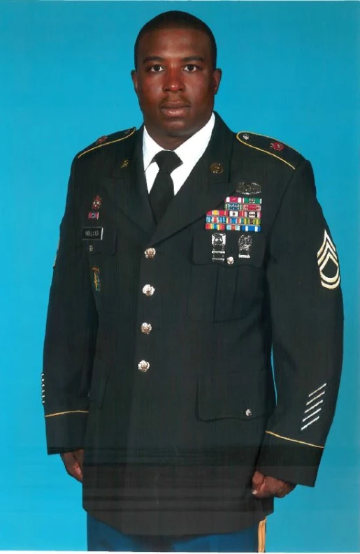 a man in uniform that is posing for a picture