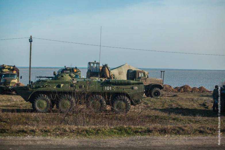 military vehicles parked on the side of a road