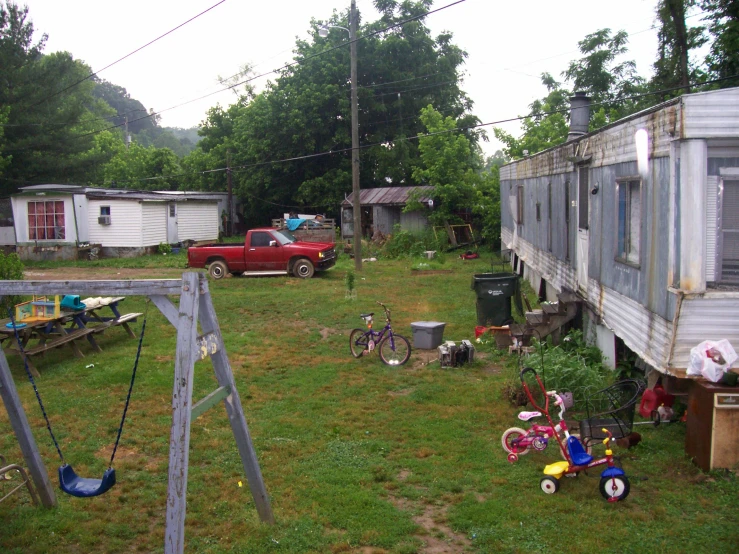 a yard that has several s's toys outside it