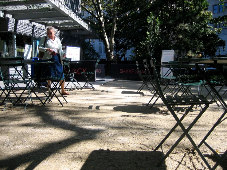 a number of chairs on a floor outdoors