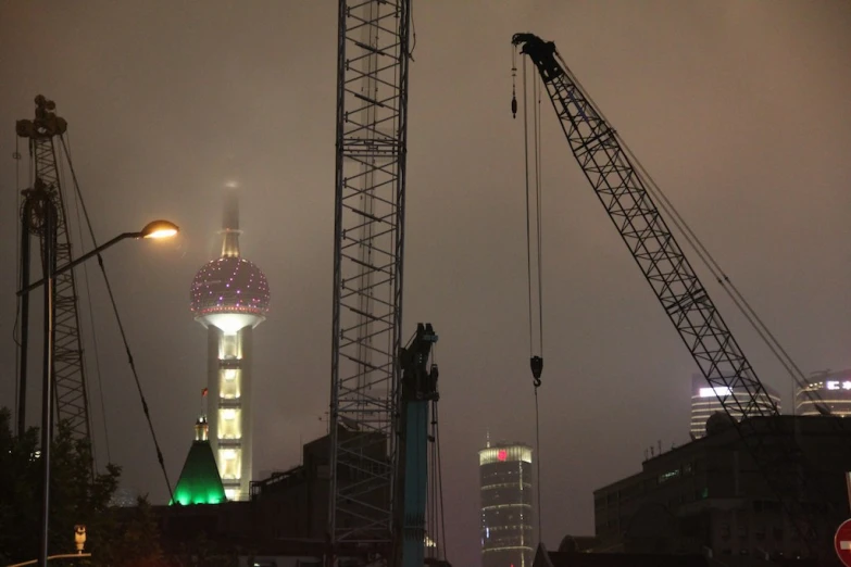 construction in the city at night with street lights