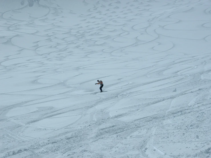 the skier is skiing down the hill in the snow