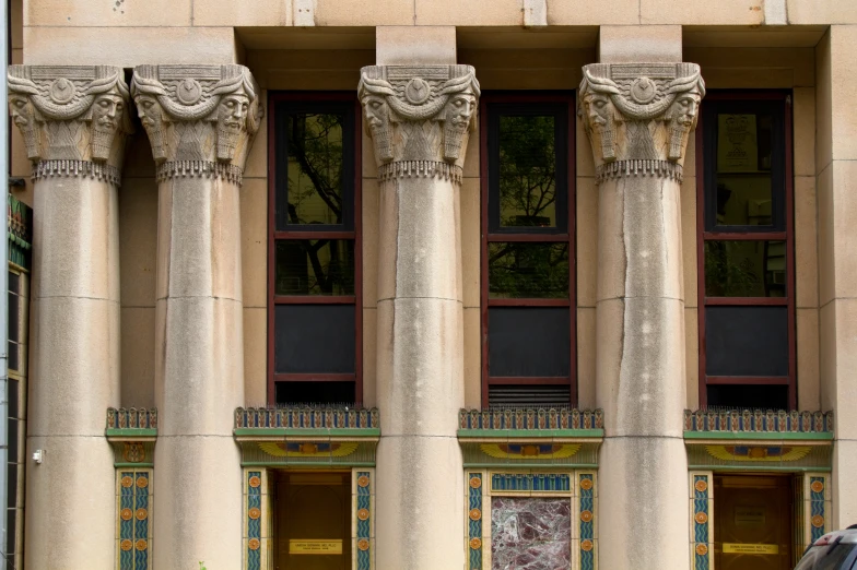 a row of three stone pillars next to each other