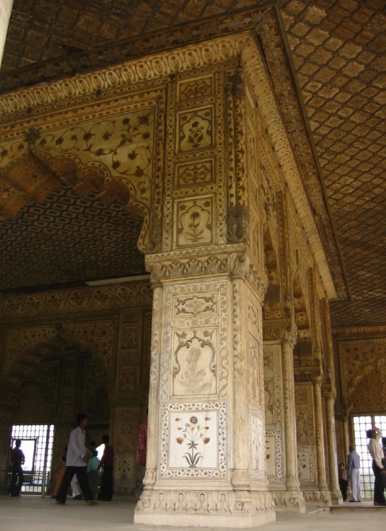 a pillar with a decorative painting on the top