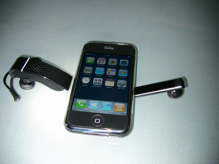 a cell phone resting on top of a metal holder