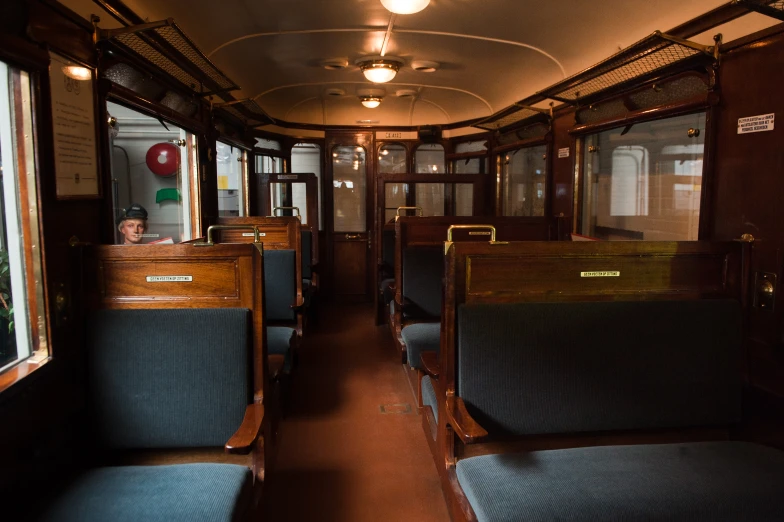 empty seats in a subway car with bright lights