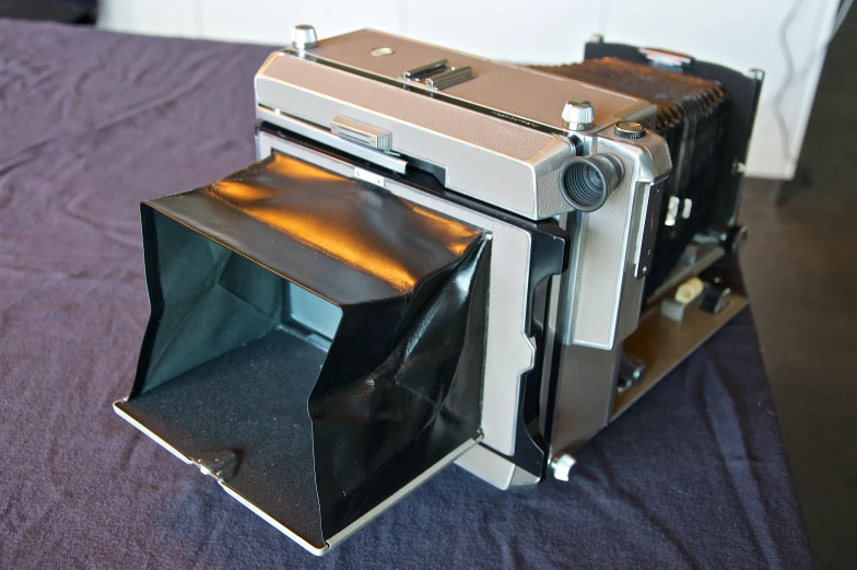 a stove with an open door sitting on top of a table