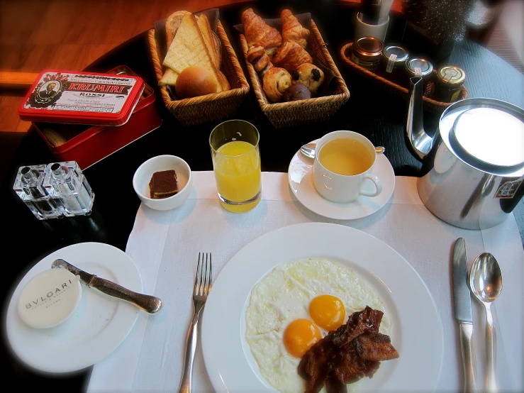 a table filled with food and glasses of liquid