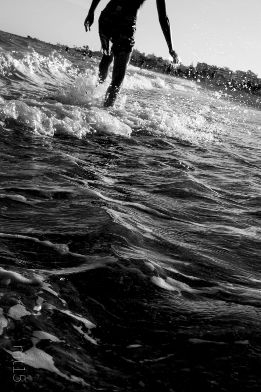 a person on a surfboard riding the waves