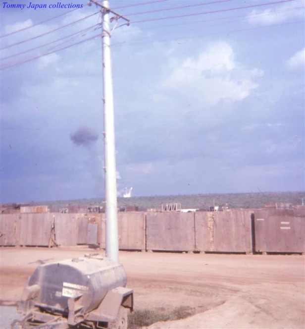 a picture of an outdoor utility area, including a telephone pole