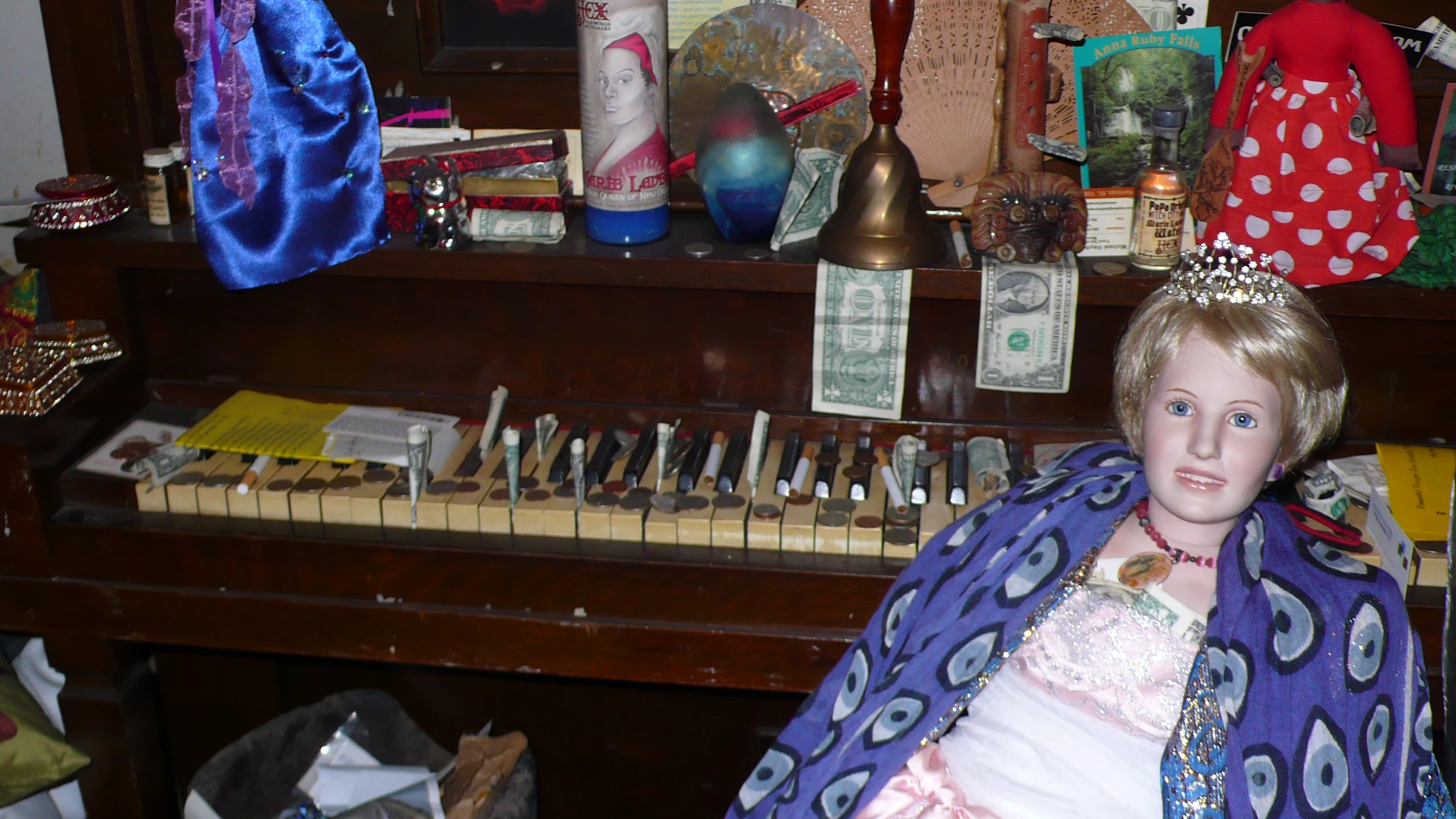 a woman doll is sitting at the piano