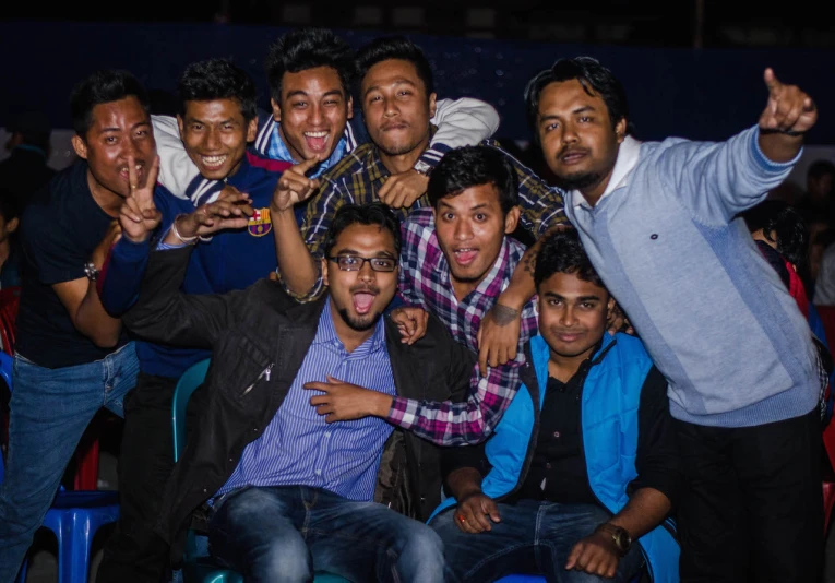 a group of men posing for the camera