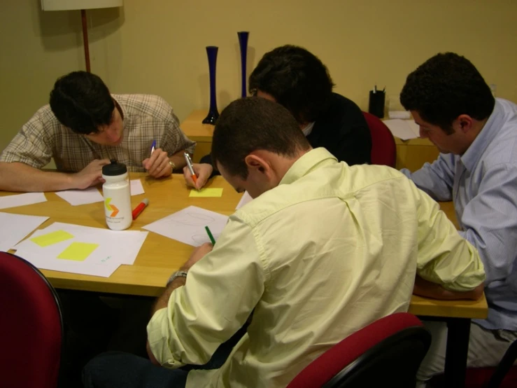 a group of students work on their homework