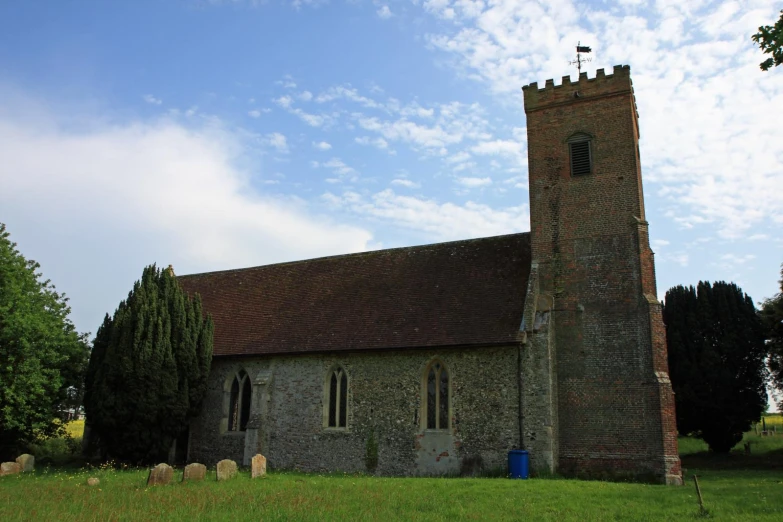 an old church with a tall brick tower