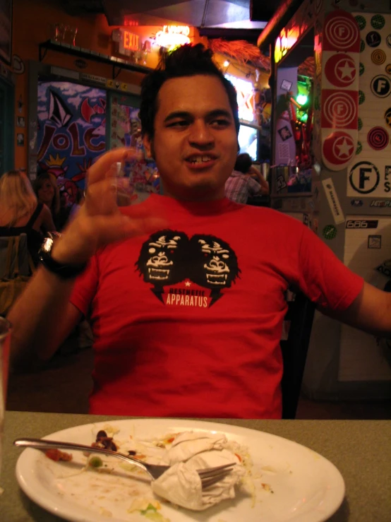 the man poses with a partially eaten piece of cake