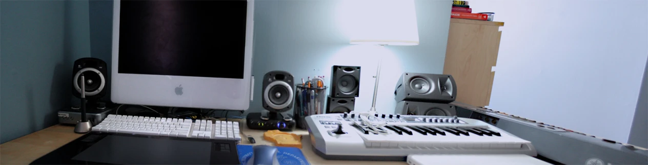 a white apple computer sitting on top of a desk