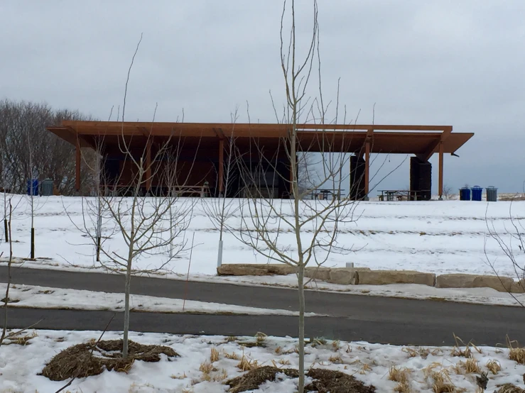 this is the entrance to the building with lots of snow on the ground