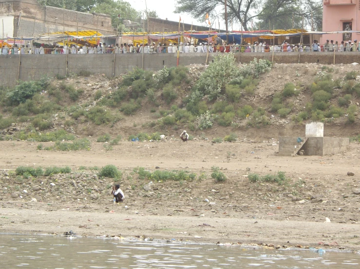 people are in the background taking pictures at the beach