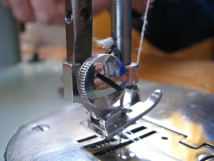 an old fashioned sewing machine is getting some action