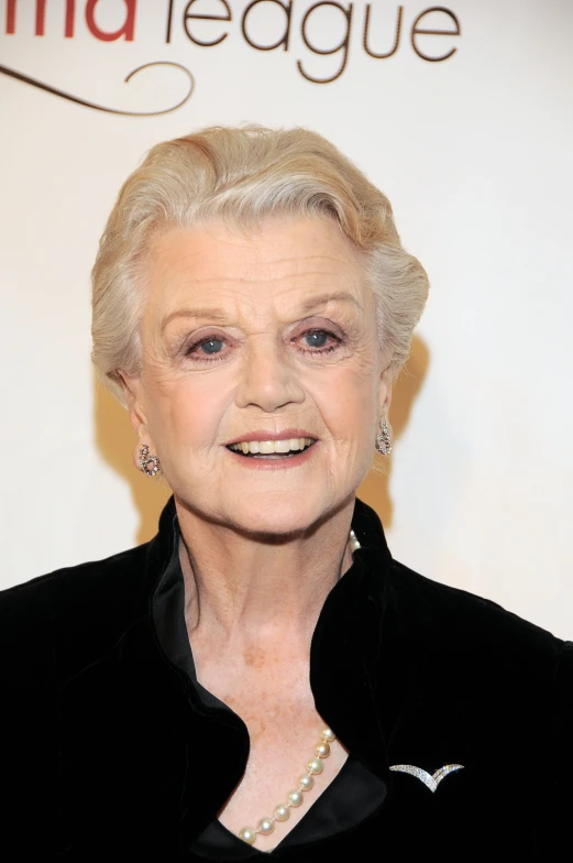 a older woman with pearl earrings on her ears