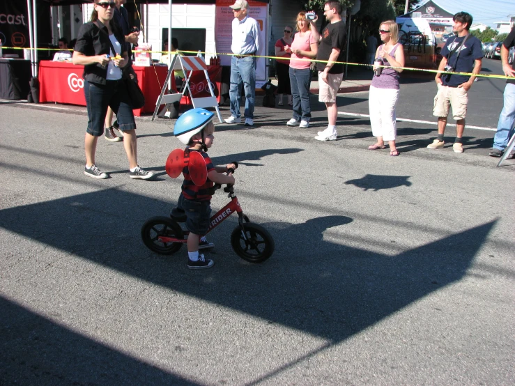 a  is playing on a small motorcycle