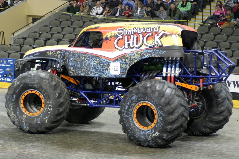 a large monster truck is in a parking lot