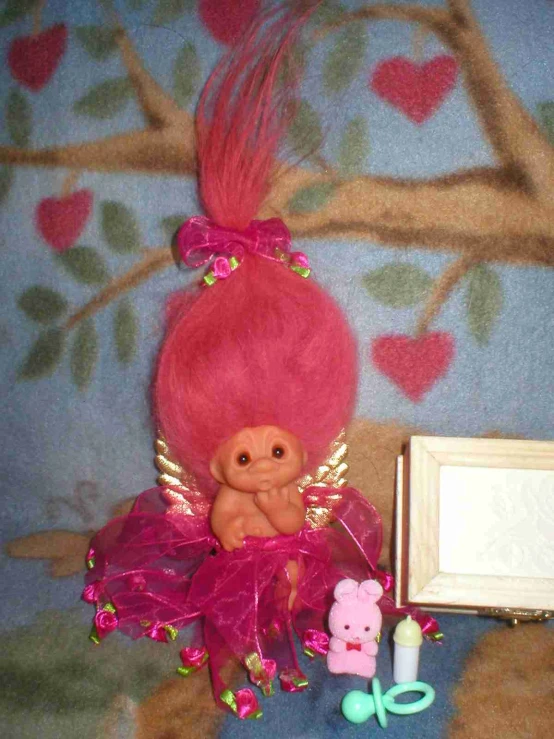 this is a doll dressed in pink hair