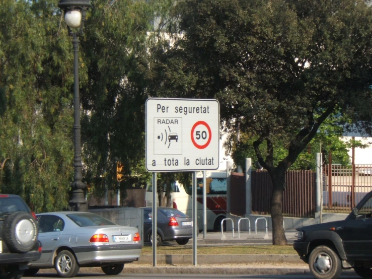 the cars are parked on the side of the street