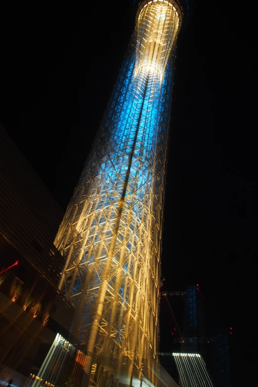 a tall skyscr is lit with a lot of christmas lights