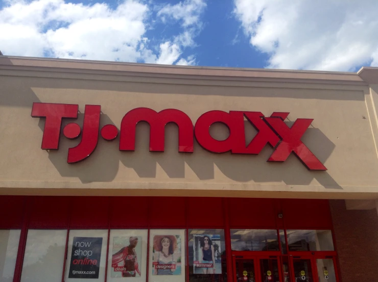 the entrance to a store called xam - t, with red lettering