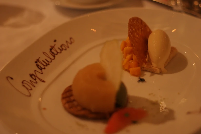 two desserts on a white plate one is a fruit