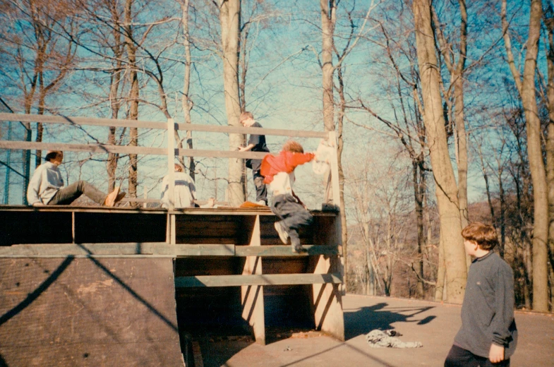 three boys at a skate park on the skateboards