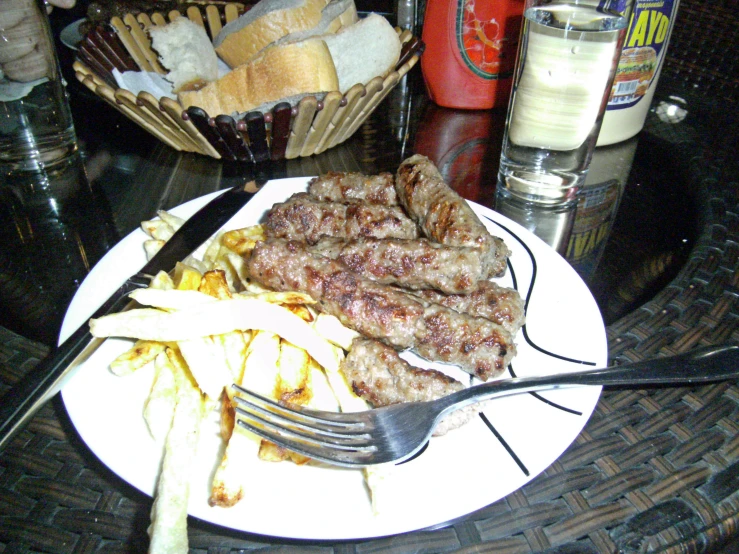 a plate that has some steak and french fries on it