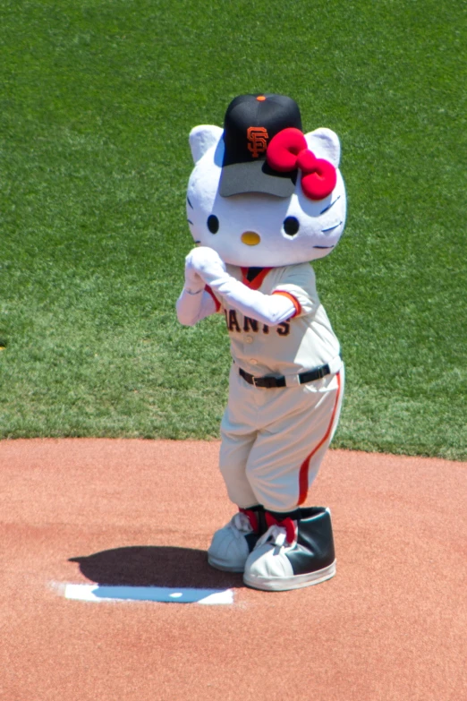 hello kitty mascot in baseball uniform on the field