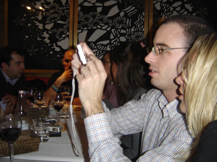 a man plays the nintendo wii at a restaurant