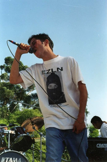 a man that is holding a microphone in his hand