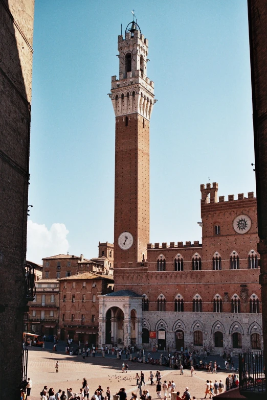 a large clock tower towering over a city street