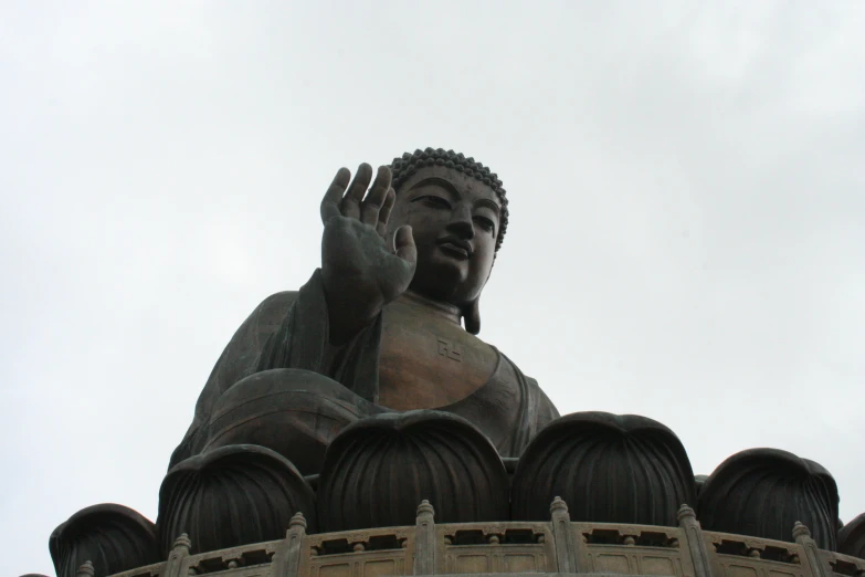 there is a buddha statue at the top of this building