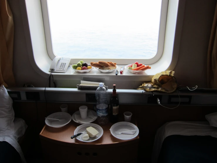 food, drinks and snacks sit on a wooden countertop