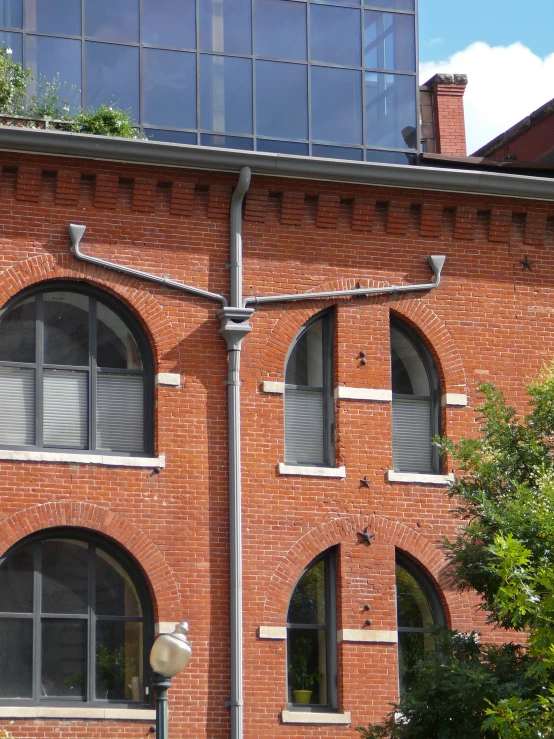 an apartment building in a town with brickwork and a lot of windows