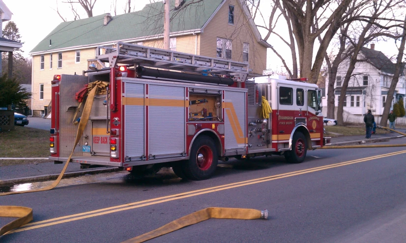 a fire truck is traveling down the road